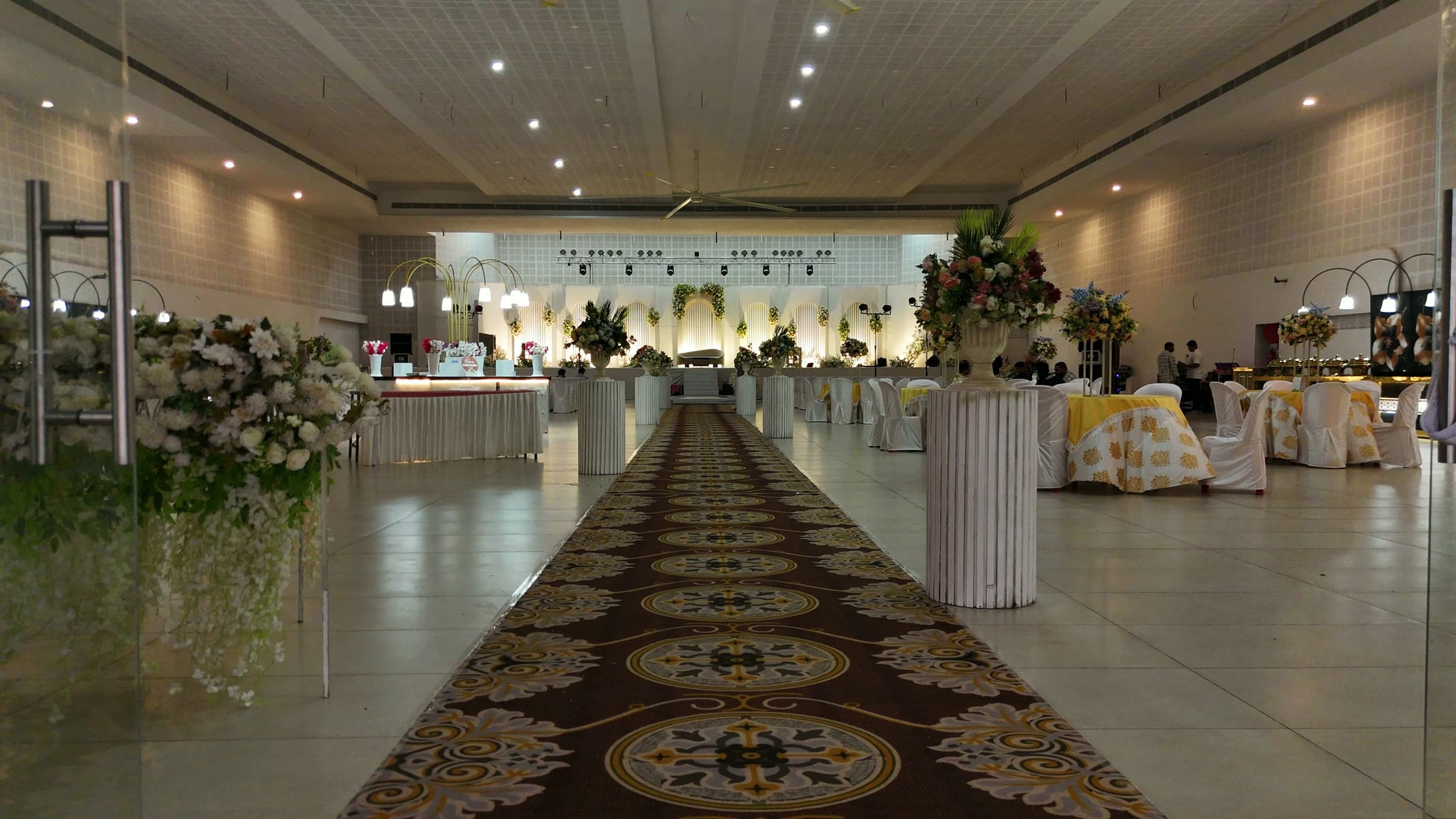 The patterned runner leading from the entrance into the hall
