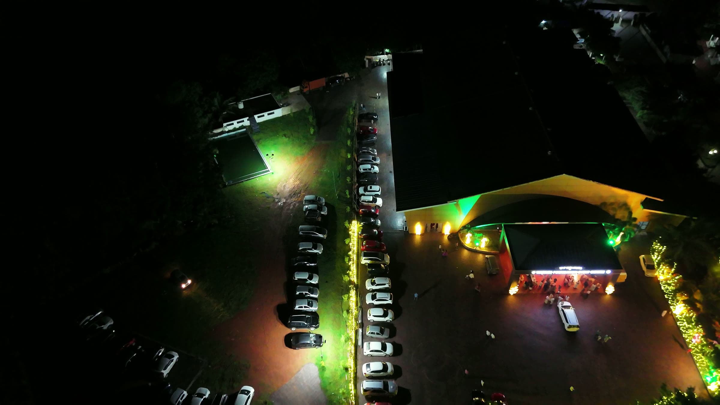 The forecourt and entrance lit after dark