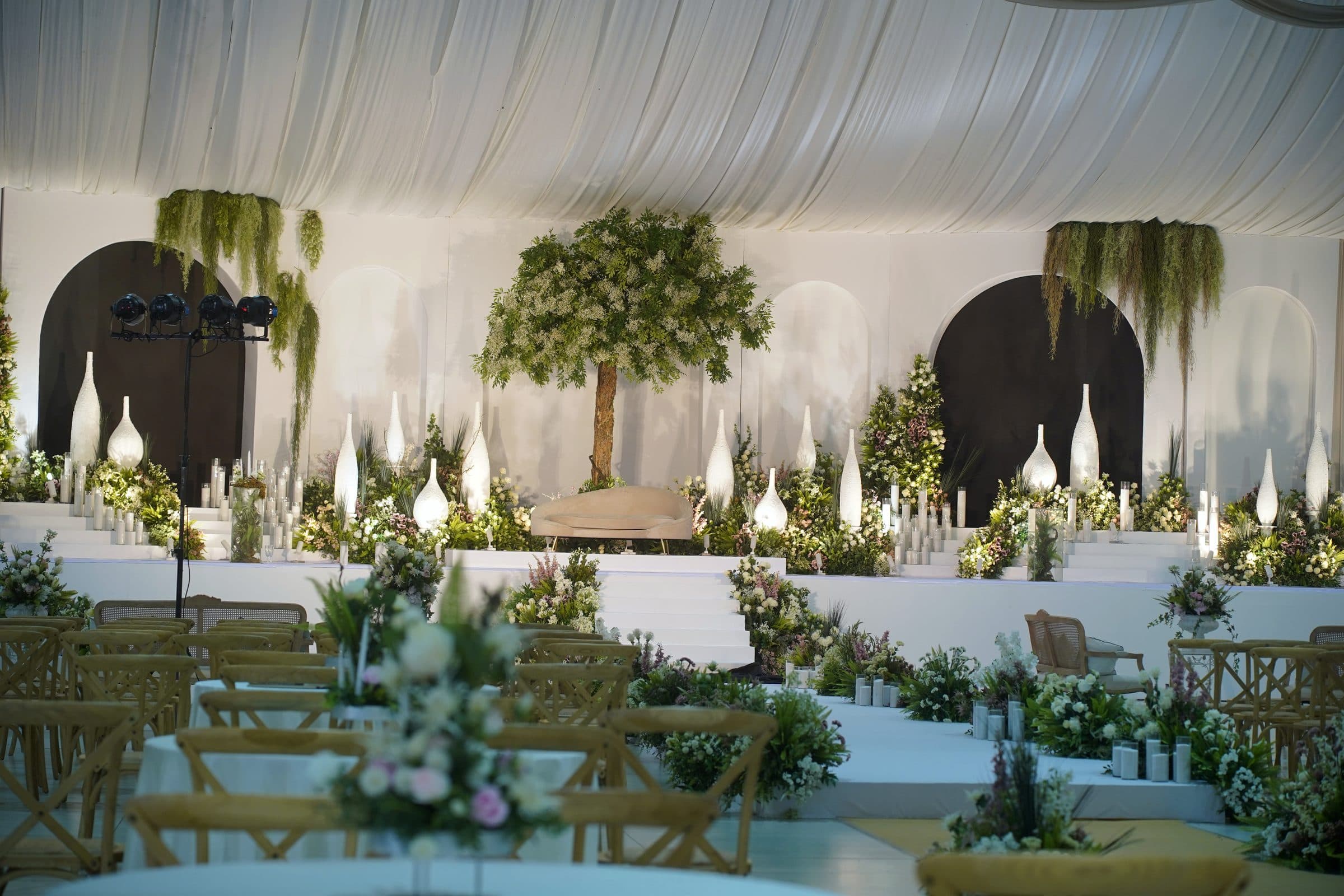 The stage viewed across dressed guest tables