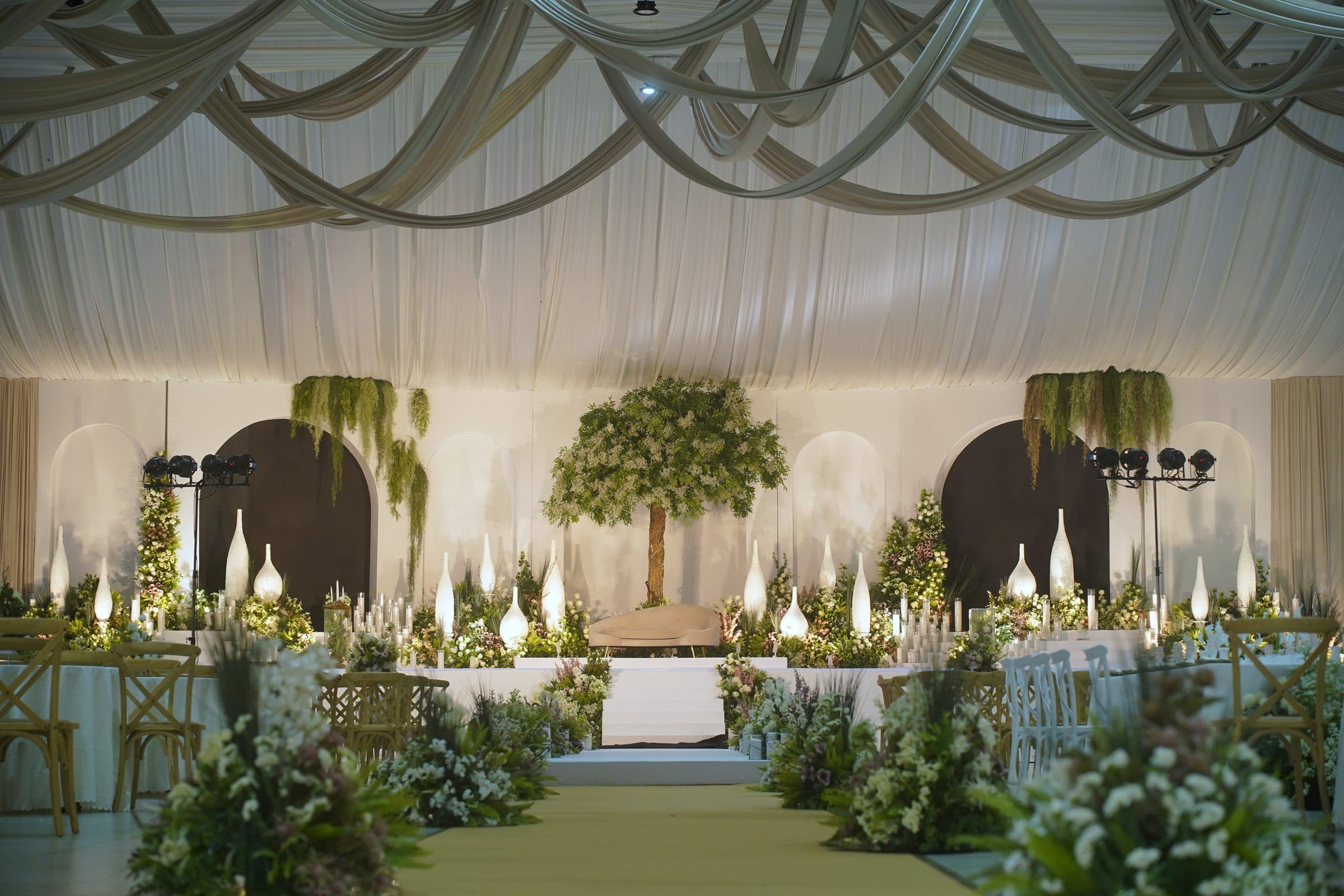 The stage seen head-on beneath the draped ceiling